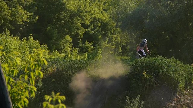 extreme sports motocross motorcycle jumping on a race on high speed rail amped through mud super slow motion racers fly over jump freestyle stunt