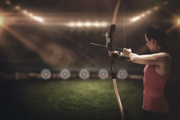 Side view of woman practicing archery