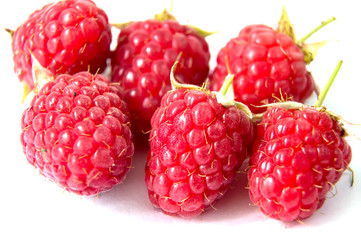 ripe raspberries isolated on white background close up