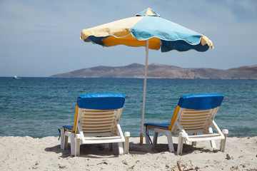 Parasols and sun loungers on the beach island of Kos