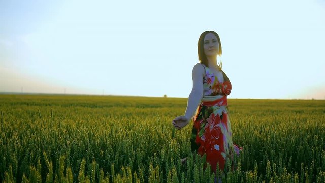 girl in a field smiling emotions hands dancing ears laughs runs listening to music girl portrait sun beautiful sunset light dress posing road smile mystery