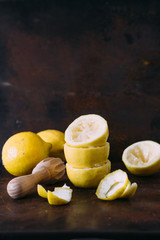 Fresh lemons and juicer. selective focus