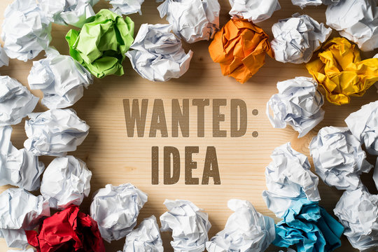 crumpled paper as symbol for ideas with the sentence "wanted: ideas"