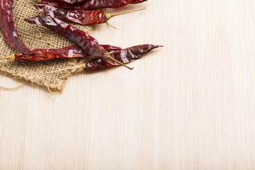 Red chilli on wood table