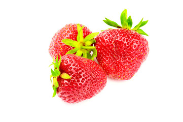 Three ripe, organic strawberry isolated on white background.