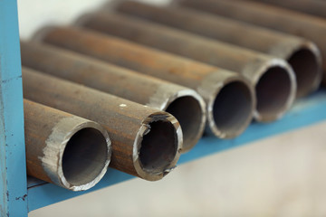 Copper industrial tubes on the shelf
