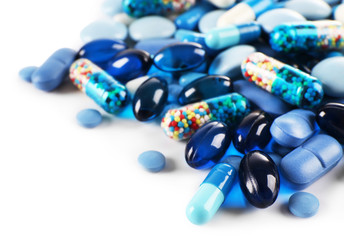 Blue pills isolated on white