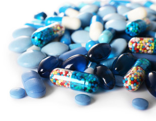 Blue pills isolated on white