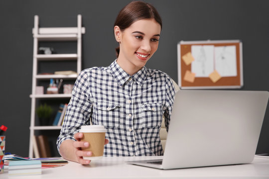 Woman working at computer at office