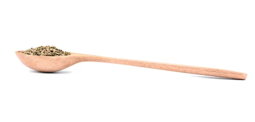 Rolgordijnen Dried oregano in spoon on white background © Africa Studio