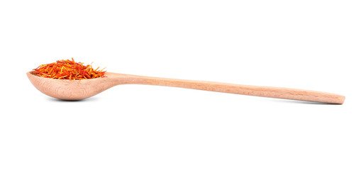 Dried saffron in spoon on white background