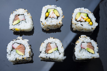 Sushi set isolated on black background