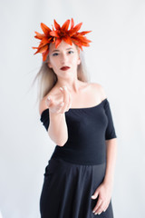 beautiful young girl in a black lenses with lilies