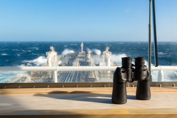Binocular on the windowsill of navigation bridge.