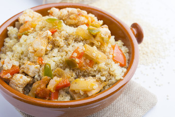 High-key image of white plate with quinoa lentil salad and bowl
