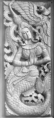  Traditional Old wood carving on the wall of Temple in Thailand,