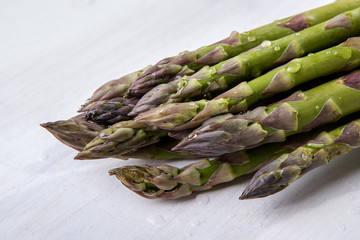 Green wet asparagus on the table