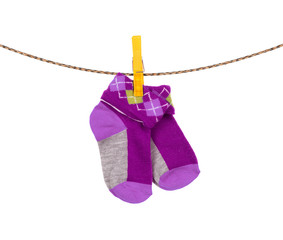 baby socks hanging on a clothesline