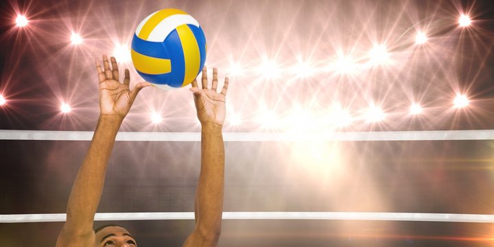 Composite image of sportsman playing a volleyball