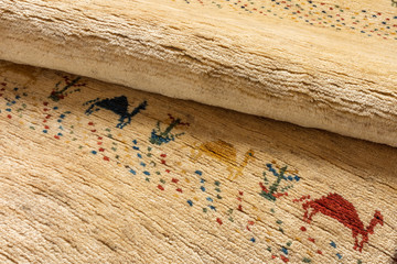 Close up of a hand made iranian Gabbeh runner oriental carpet wi