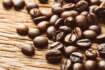 Roasted coffee bean on grunge wood background