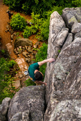 Men climbing vertical wall, Poland