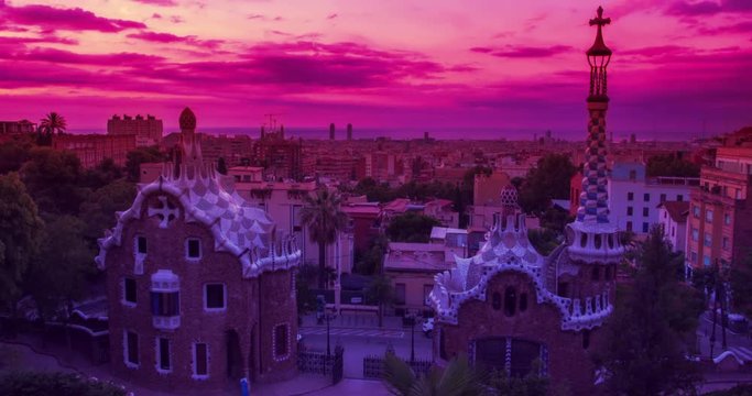 Park Guell designed by Antoni Gaudi in Barcelona. Barcelona timelapse. Sunrise in Barcelona. City skyline at sunrise. Time lapse clouds over Barcelona city. Travel landmarks in Barcelona