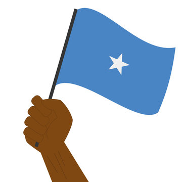 recommend clip art: Hand holding and raising the national flag of Somalia