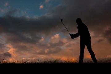 Composite image of golf player taking a shot