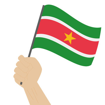 recommend clip art: Hand holding and raising the national flag of Suriname