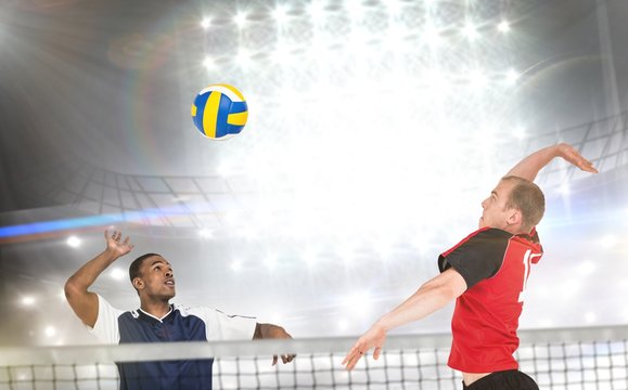 Composite image of sportsmen are playing volleyball 