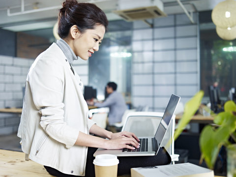young asian woman working in office