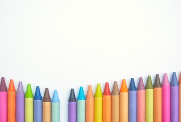 Crayons lined up in a V shape with one missing