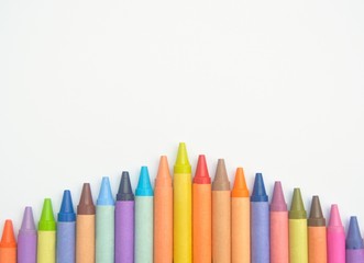 Colorful crayons lined up in an arrow shape