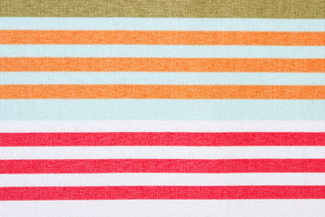 Fototapeta premium Colorful striped tablecloth as background