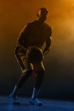 Portrait of basketball player preparing to score 