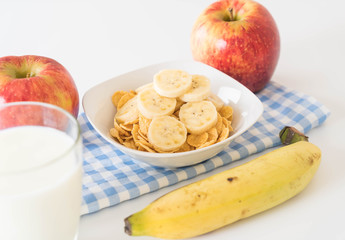 milk, apple, banana and cornflakes