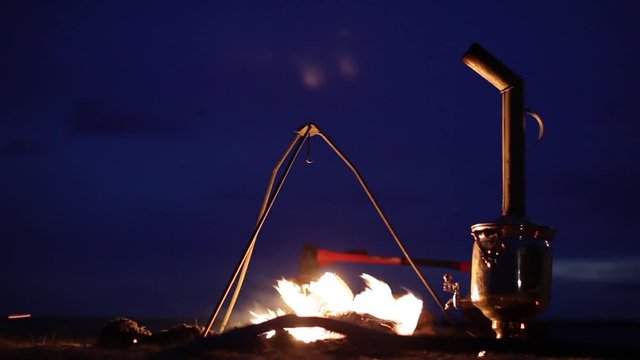 Bonfire. Fireplace. Samovar. Ax. Wind. Sparks.