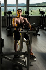 Fototapeta na wymiar Young Man Doing Heavy Weight Exercise For Back