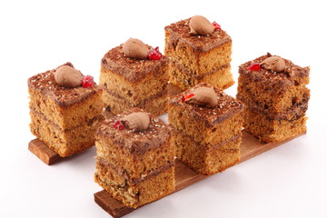 Tasty chocolate cream layer cakes in white background,.