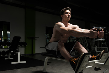 Naklejka na ściany i meble Muscular Man Doing Heavy Weight Exercise For Back