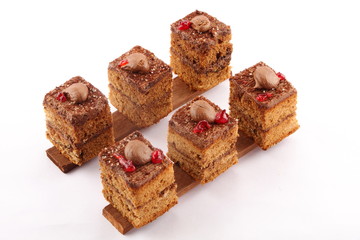 Chocolate cream cake topped with chocolate and cream.white background.selective focus photograph.