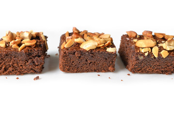Many pieces of brownie on white background - isolated