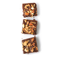 Many pieces of brownie on white background - isolated