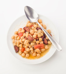 vertical view of homemade stew, chickpeas with chorizo and tomat