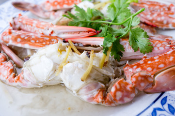 Steamed crab in Thai style served on a saucer - Selective focus