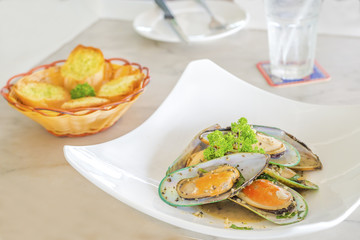 Mussels baked cheese with parmesan and herbs