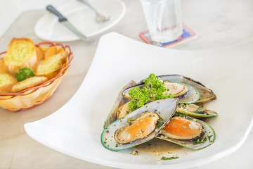 Mussels baked cheese with parmesan and herbs