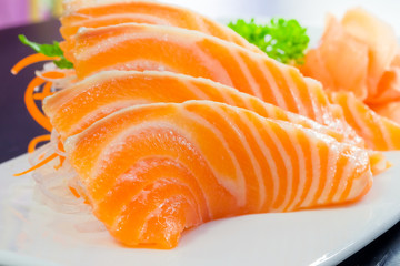 Salmon sashimi or shake / sake served with preserved ginger