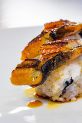 Japanese eel sushi served on a white dish